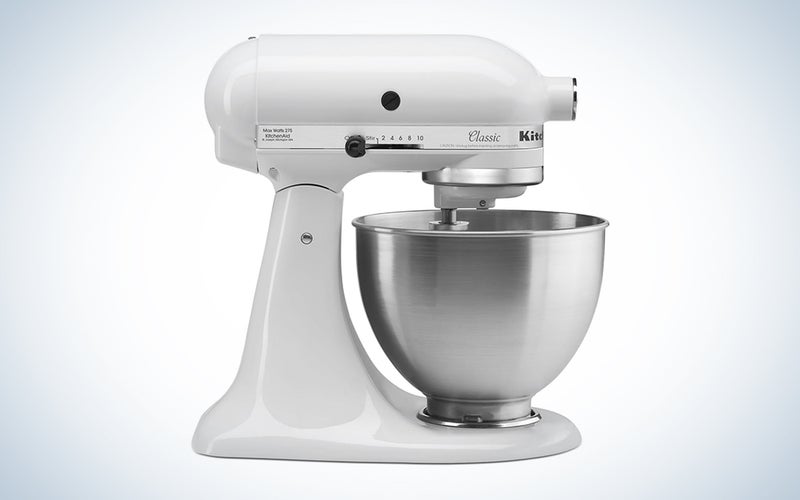 A white KitchenAid classic mixer on a blue and white background