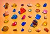 neatly arranged rows of colorful items purporting to be crystals