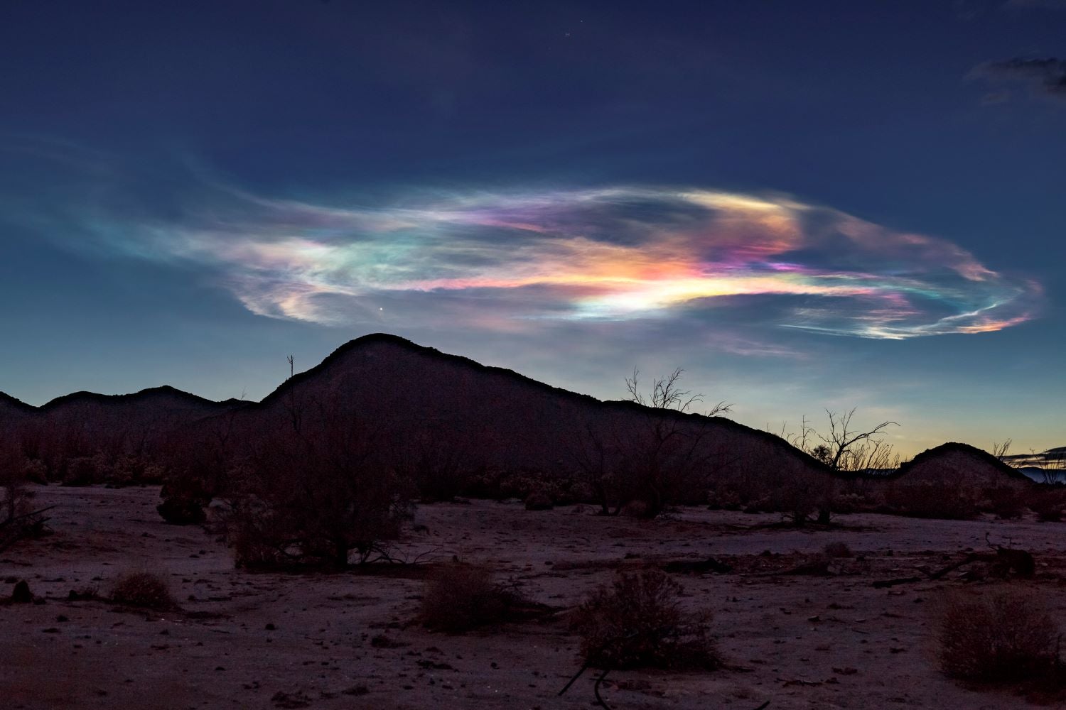 A rainbow of colors appears as clouds in the American West.