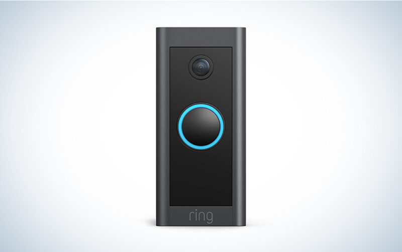 A black Ring Video Doorbell Wired on a blue and white gradient background