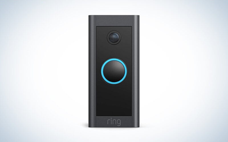 A black Ring Video Doorbell Wired on a blue and white gradient background