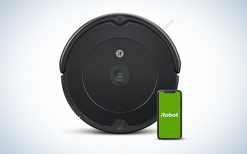 A black The iRobot - Roomba 694 WiFi Connected Robot Vacuum is the best budget Roomba on a blue and white background