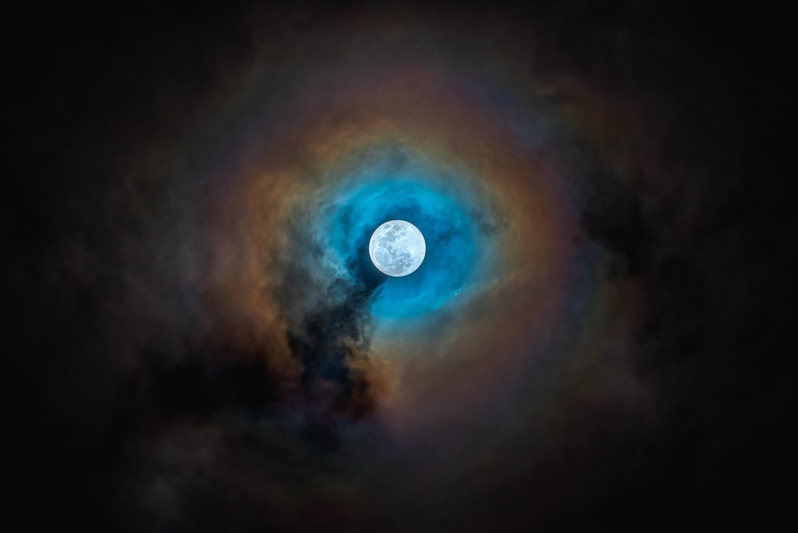 Full moon with an iridescent ring