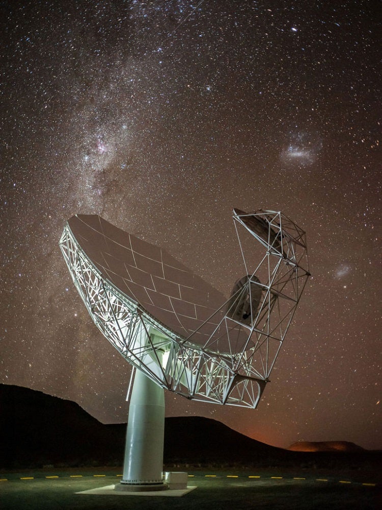 MeerKAT radio telescope dish under starry sky