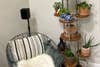 Perlesmith speaker stand with a Samsung HW-Q900B rear speaker behind a chair and plant tower 