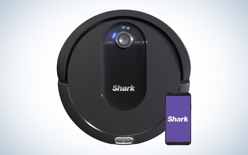A black Shark robovac on a blue and white gradient background