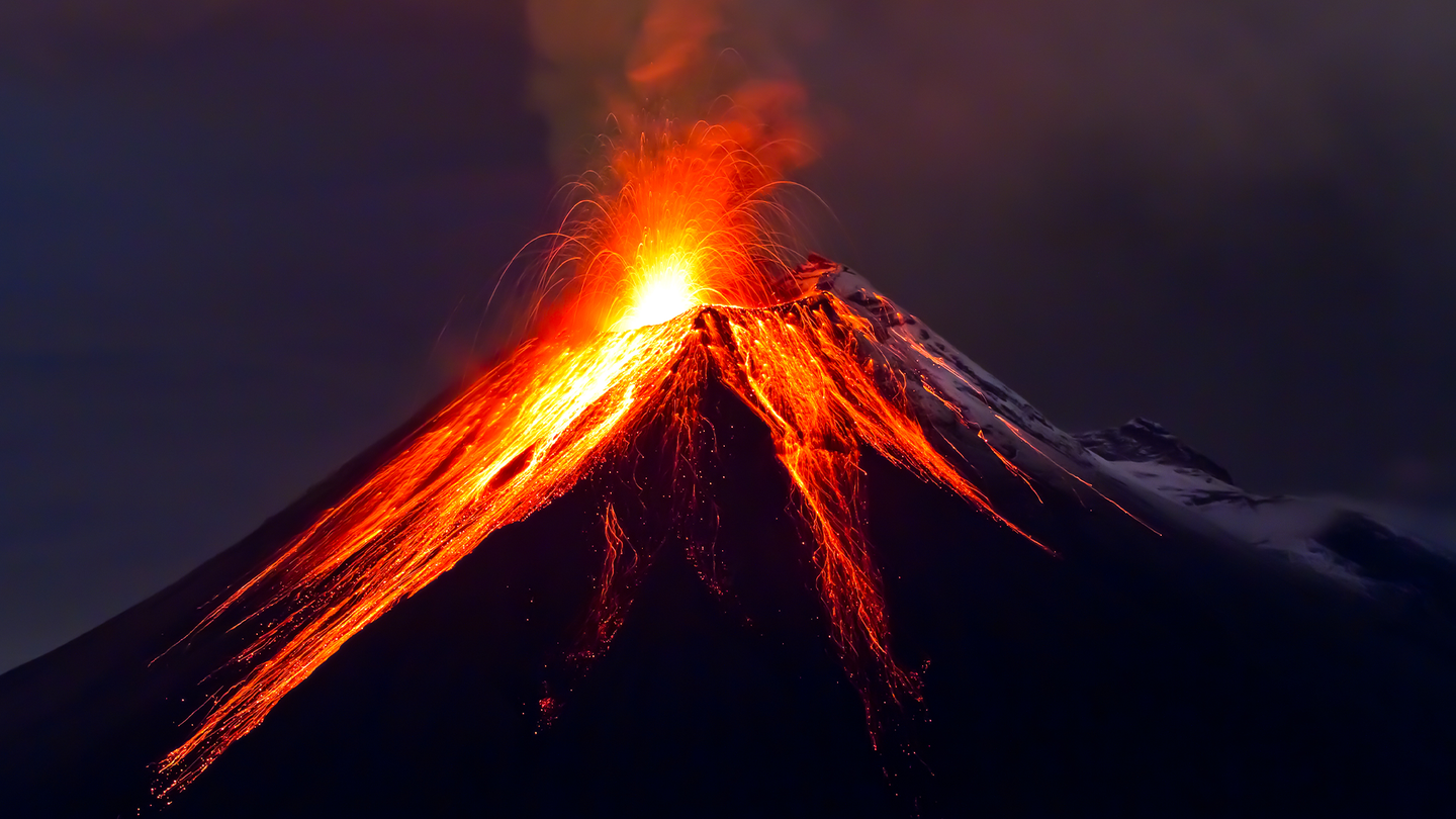 A volcano spews lava and ash. In roughly 250 million years, massive tectonic activity could push together all of our current landmasses into a supercontinent like Pangea and make the climate inhospitable to humans and other mammals.