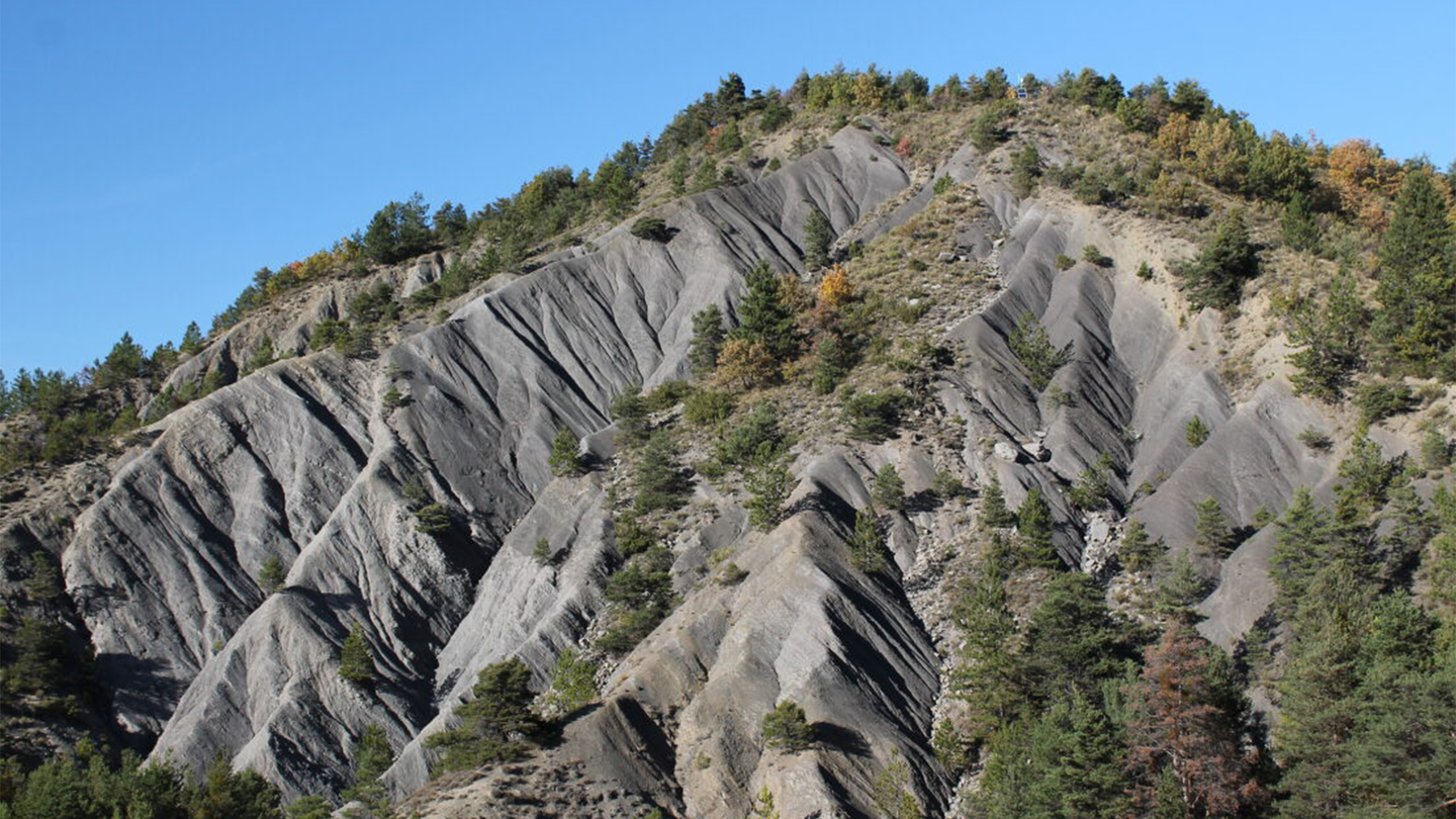 Exposed sedimentary rock on a mountain slope. High erosion in southern France exposes these sedimentary rocks to weathering, releasing carbon dioxide as the ancient organic carbon breaks down.