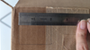 Ruler measuring a square on a cardboard box. 