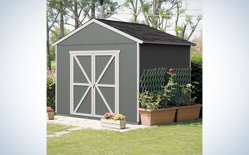 A shed in a backyard on a blue and white background