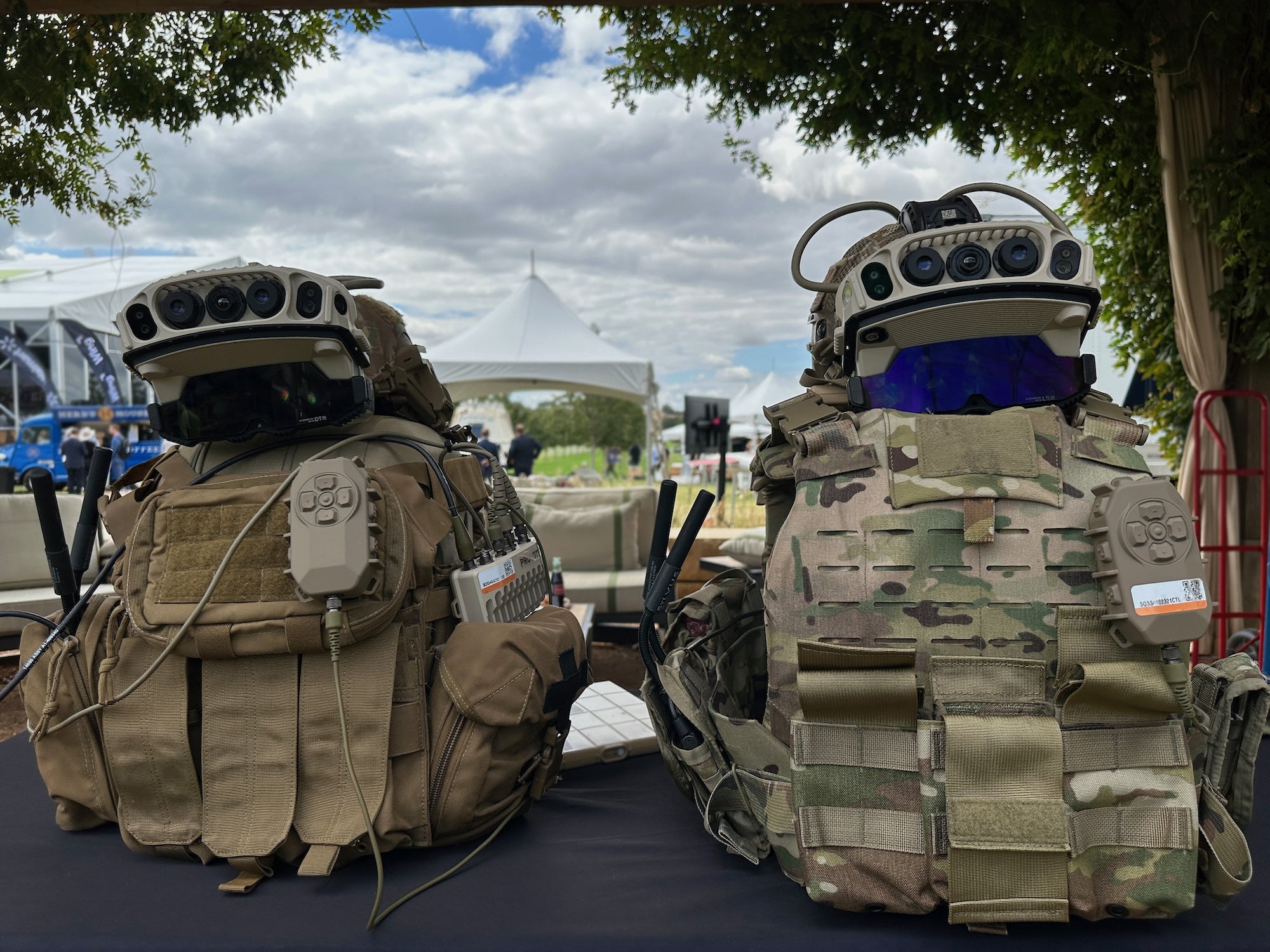 The goggle-like pieces of gear on top of the backpacks are the latest iteration—version 1.2—of the Army’s IVAS (Integrated Visual Augmentation System), which has been a challenging technology to get right and has a history of causing issues like nausea. The goal is to give a soldier a head-up display that can show a compass heading, map, or other information right in front of their eyes. Think of them as augmented reality goggles for soldiers that continue to be a work in progress; they’re made by Microsoft. 