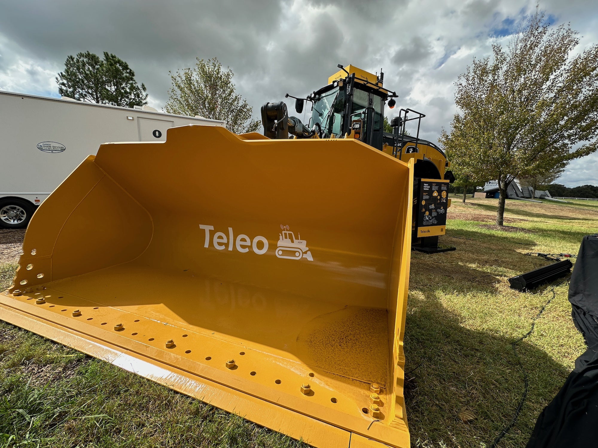 This piece of construction equipment is a John Deere wheel loader, but on top of the cab is special equipment from a company called Teleo that allows the machine to be remotely operated from large distances. Popular Science had the chance to control a piece of construction equipment called a compact track loader in California from a base station in Texas, and observed a Teleo employee at the same Texas station operate a different large piece of construction equipment—a Komatsu WA500-8 wheel loader—in Oulu, Finland. 