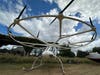 This helicopter-like prototype aircraft is called a Volocopter, and it holds one person. Up top are 18 all-electric propellers mounted on a ring that’s about 26 feet in diameter. It can fly for about 20 minutes and has a range of about 11 or 12 miles. 