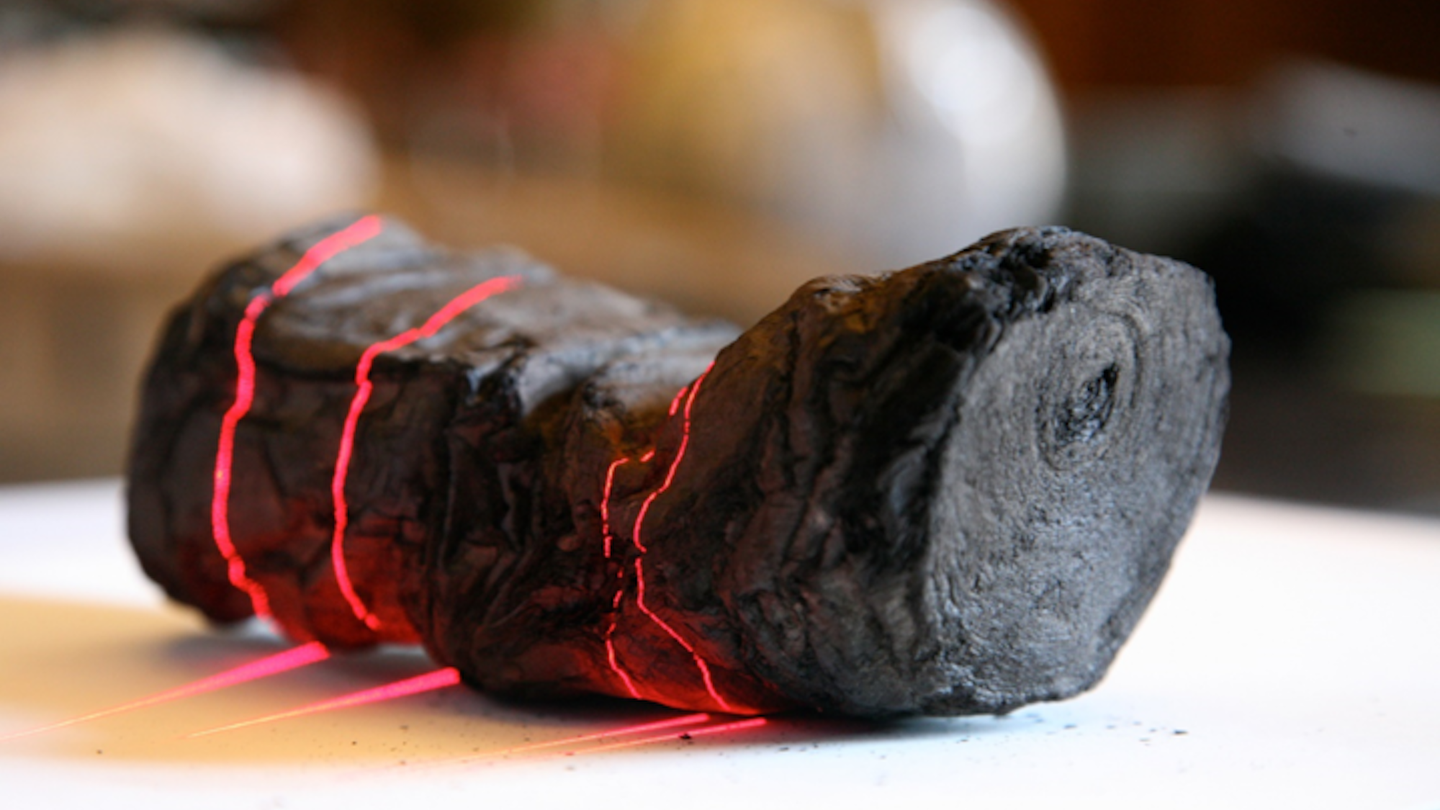Charred scroll from Herculaneum undergoing laser scan