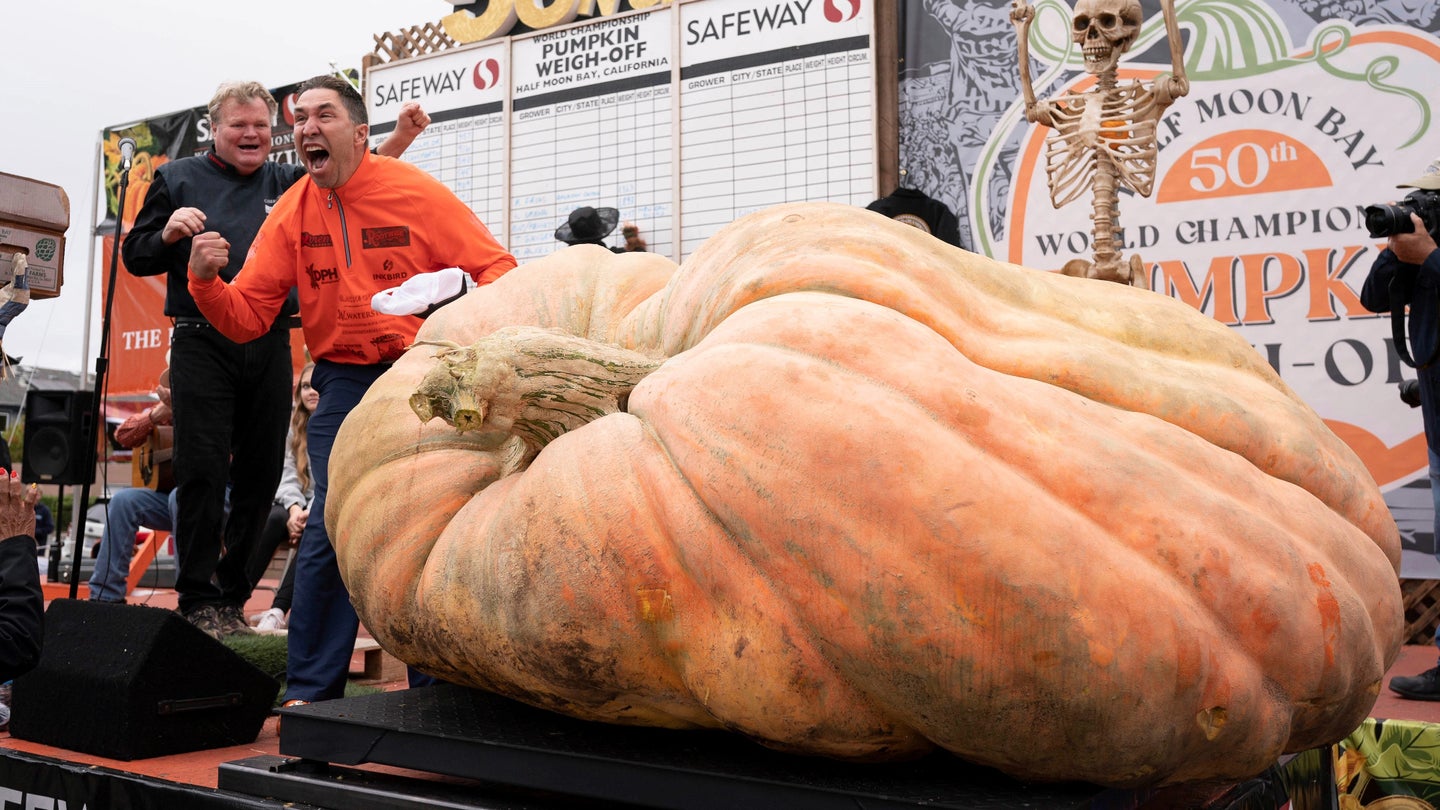 Travis Gienger of Anoka, Minnesota celebrates during a pumpkin-weighing contest in Half Moon Bay, California.