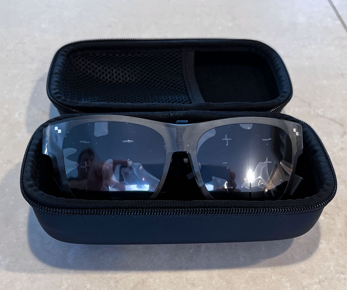 TCL smart glasses in their charging case