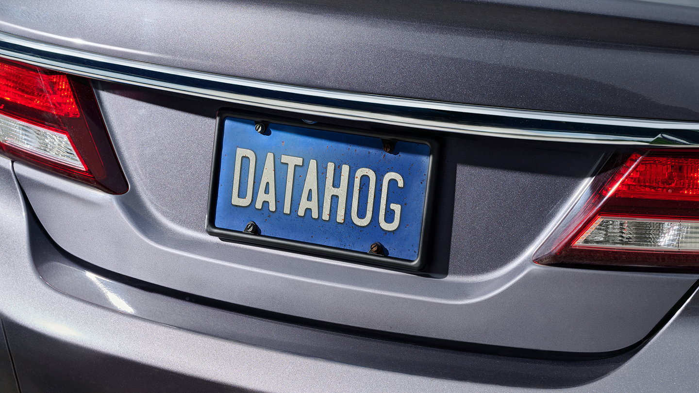 Car with a license plate saying "data hog"