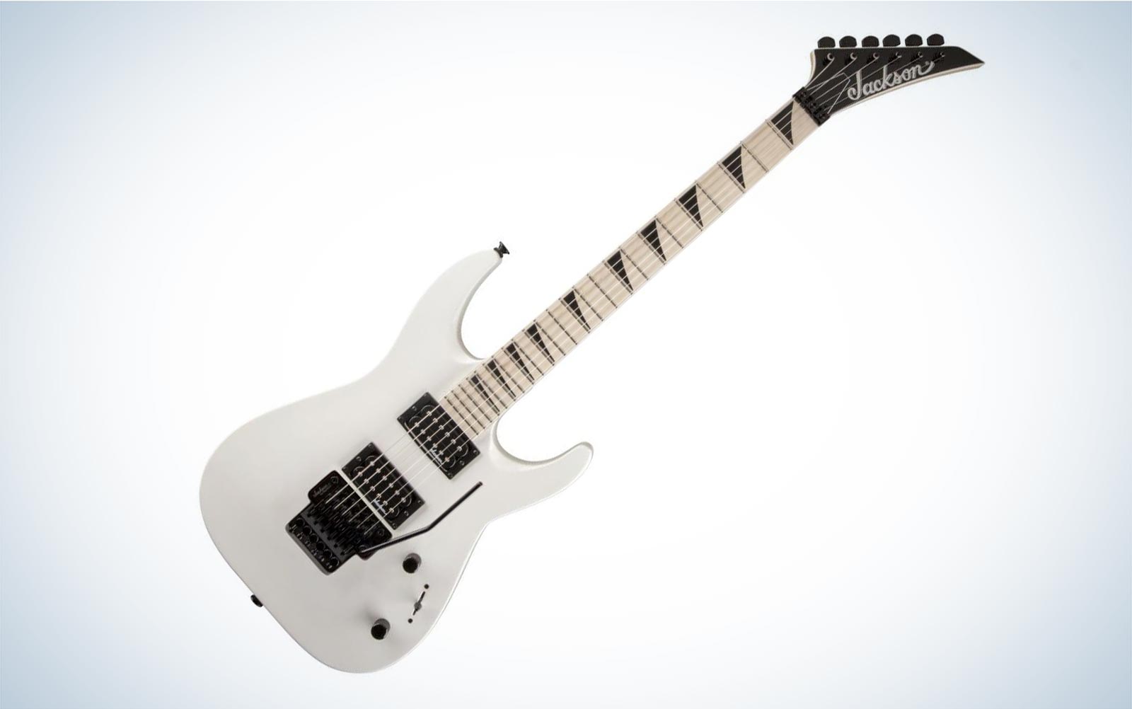 A white Jackson Dinky DKA M electric guitar tilted to the right on a plain background