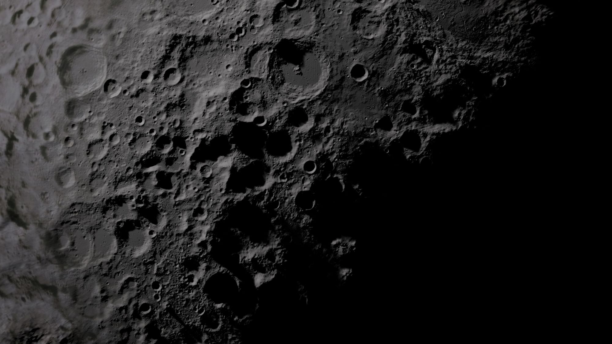 Pale craters on the moon's lunar surface, with dark shadows below.