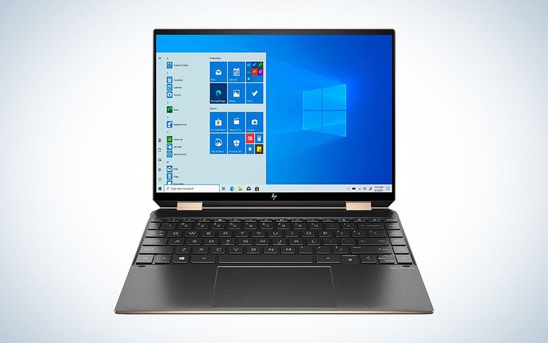 A black HP Spectre x360 Luxury 14T laptop on a plain background