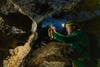 Woman using HULC lunar camera in underground cave