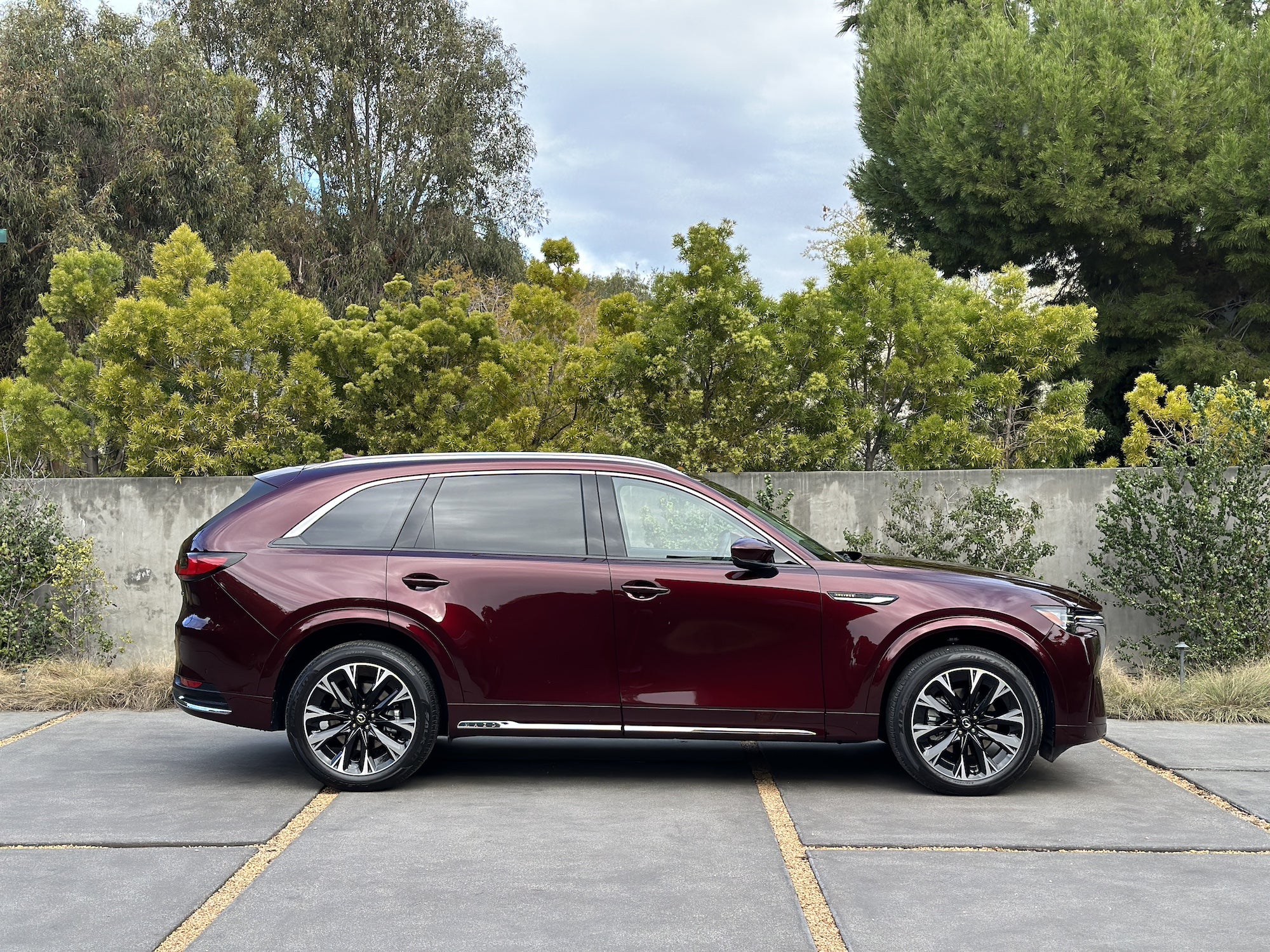 A Mazda CX-90 in Artisan Red.