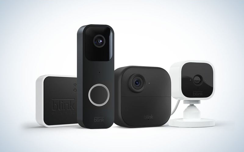 A Blink camera bundle consisting of a video doorbell, outdoor 4 camera, and mini camera on a plain background.