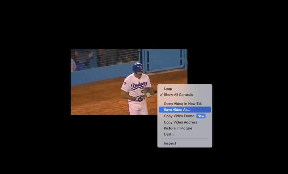 Los Angeles Dodgers player Kirk Gibson walking to bat in Game 1 of the 1988 World Series, with a menu over the video player showing where to click to save the video from Facebook.