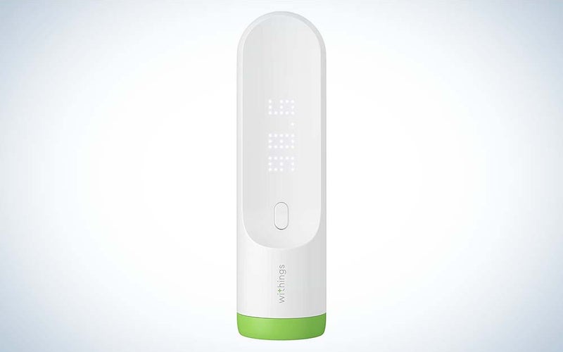 A white Withings Thermo Smart Digital Thermometer with a green ring around the bottom against a plain background.