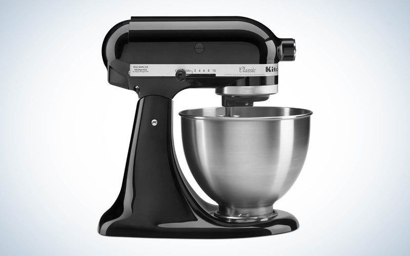 A KitchenAid black stand mixer with a silver bowl in profile on a plain background.