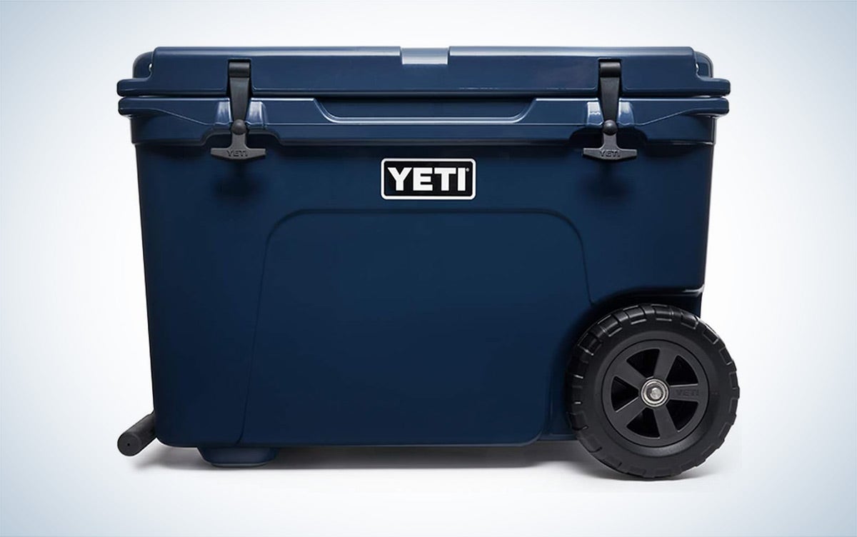 A navy Yeti Tundra Haul wheeled cooler is placed against a white background.