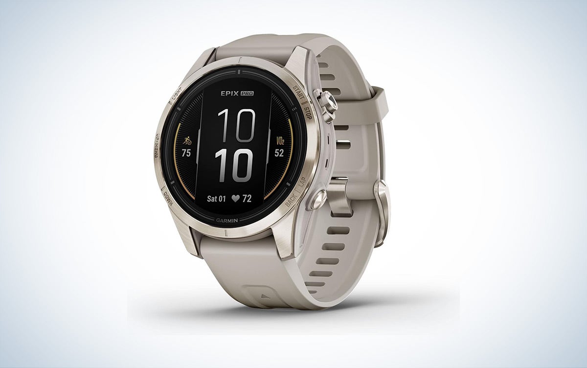 A tan and soft gold Garmin epix Pro Sapphire is place in front of a white background with a gray gradient.