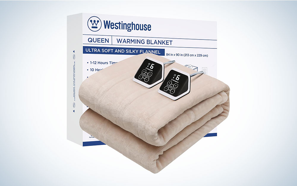 A taupe Westinghouse electric blanket with two controllers on a plain background