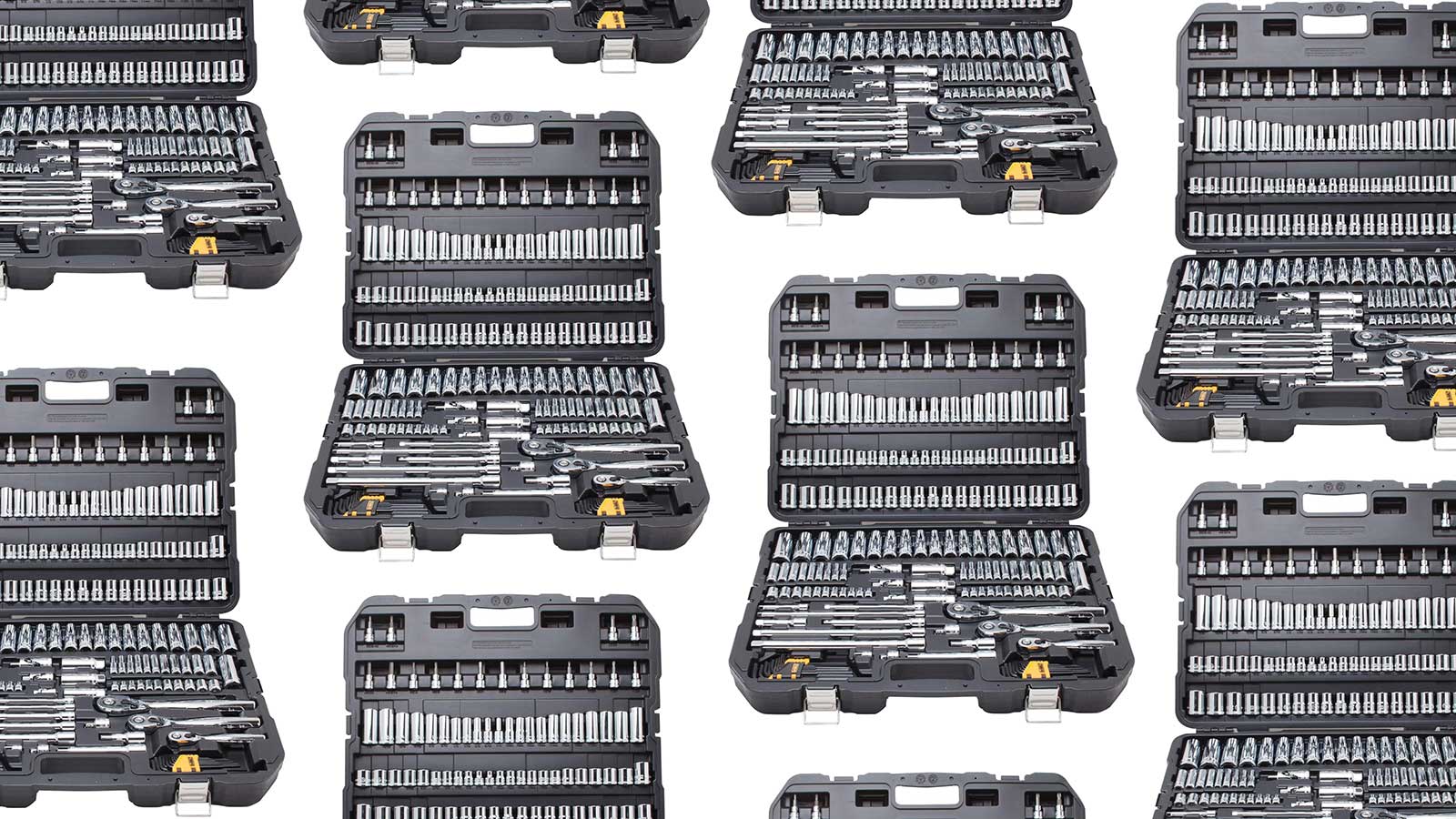 An array of DeWalt mechanics tool sets arranged in a pattern on a plain background.