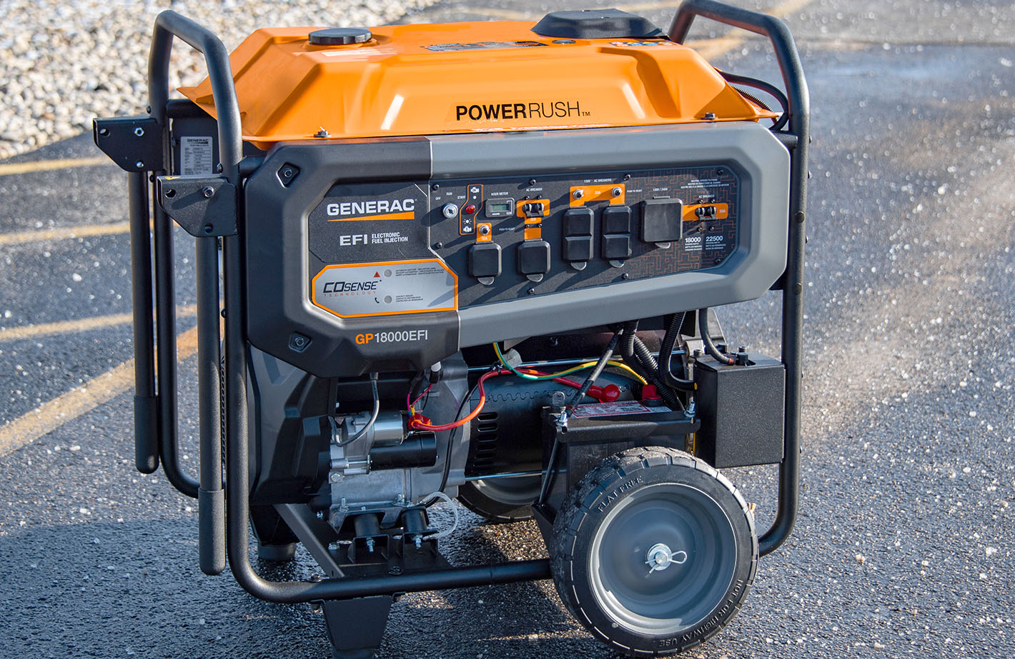 Orange and grey Generac 18000EFI portable generator on wheels in a parking lot
