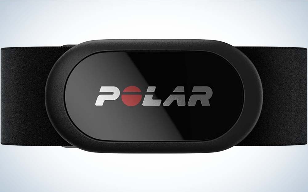 A black Polar H10 Heart Rate Monitor with the word "Polar" on the front attached to a black strap.