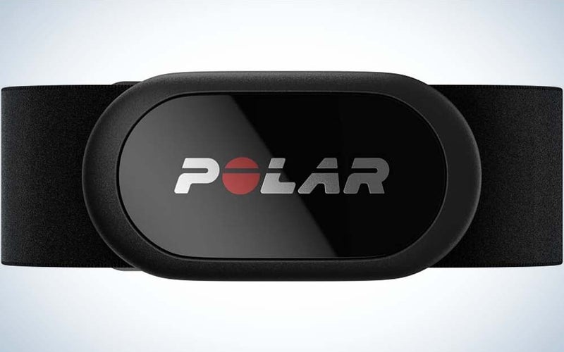 A black Polar H10 Heart Rate Monitor with the word "Polar" on the front attached to a black strap.