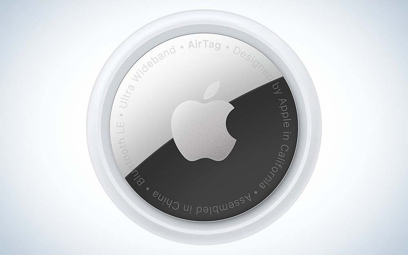 A silver Air Tag with the Apple logo in the center.