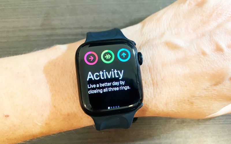A black Apple Watch Series 8 showing three activity rings that should be completed each day.