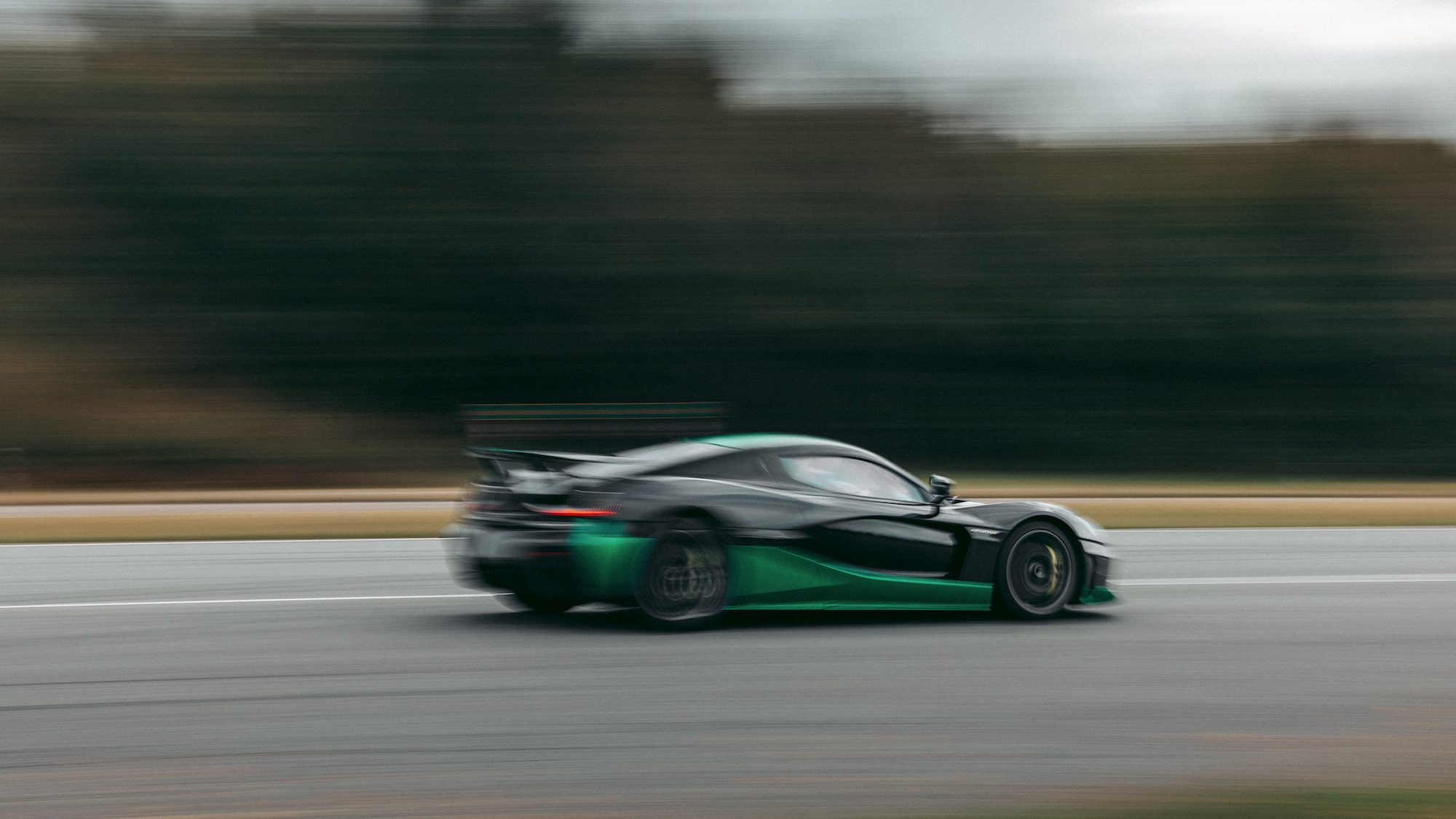 Rimac Nevera hypercar action shot driving in reverse