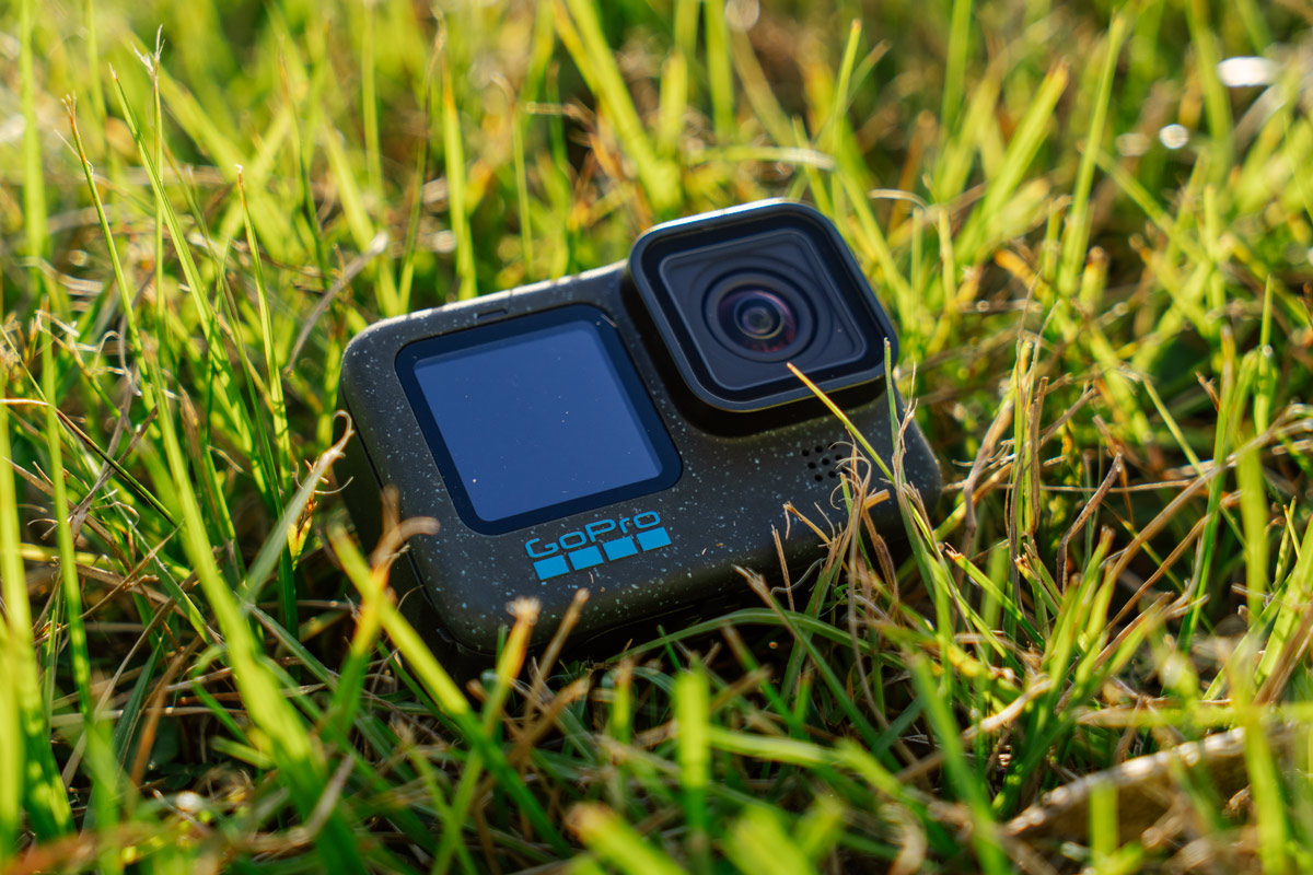 The GoPro Hero 12 Black sits on green grass.