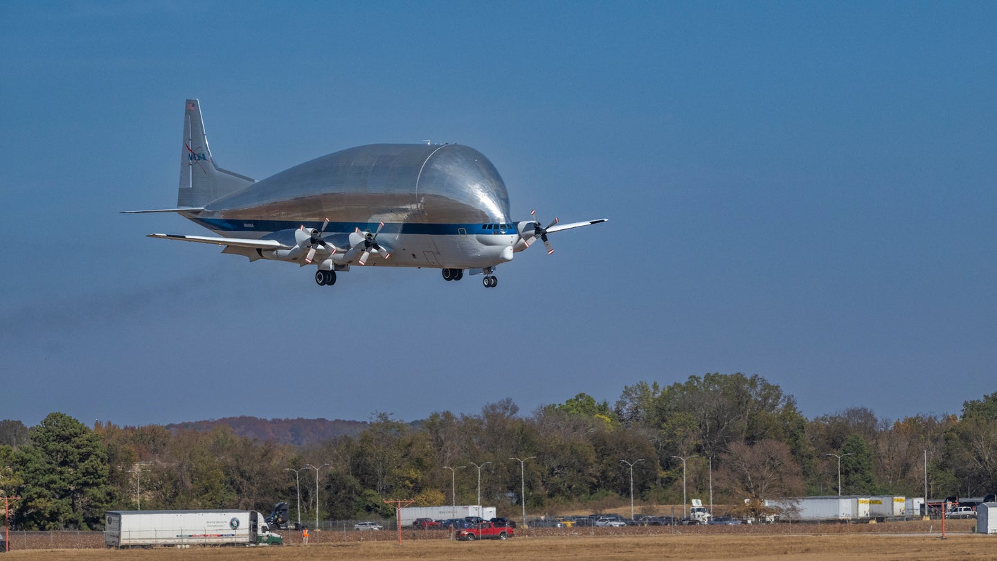 NASA's Super Guppy rocket transport prop plane landing on tarmac in Alabama