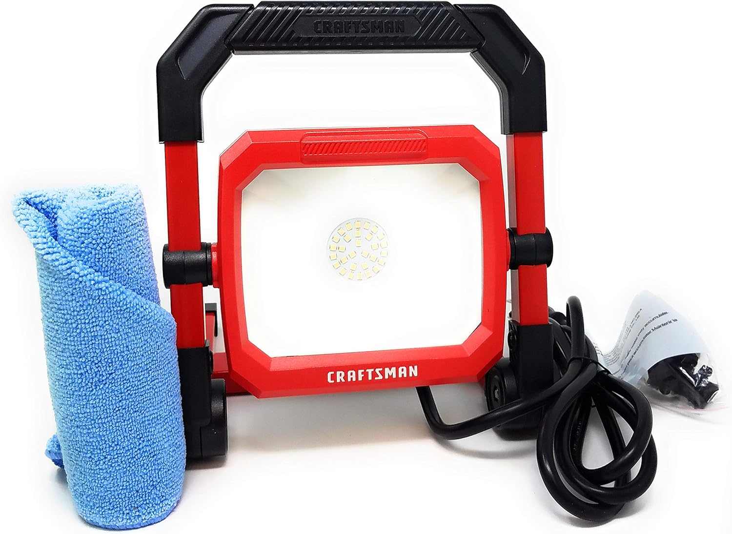 A red Craftsman LED light with a black handle and plug next to a blue microfiber towel.