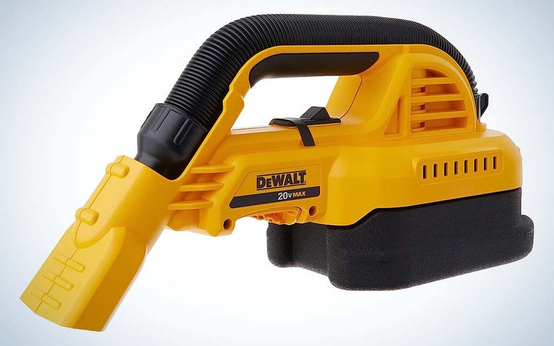 A yellow DeWalt hand vacuum with a black handle and base.
