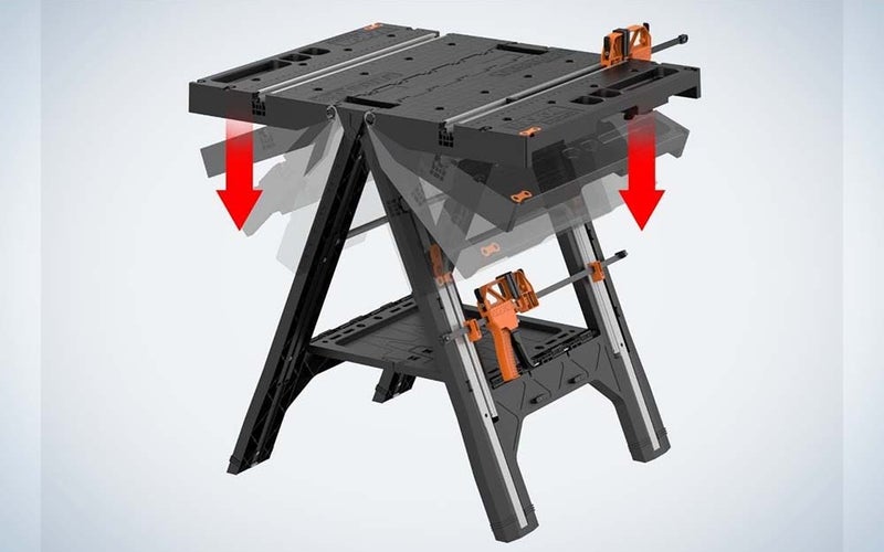 A gray WORX Pegasus Folding Table and Sawhorse with orange accents.