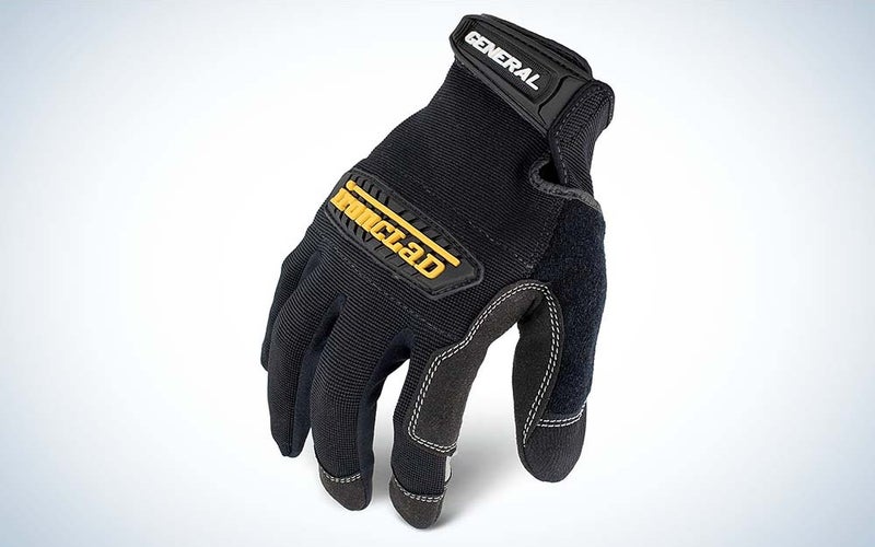 A black work glove with the fingers pointed down and the work Ironclad on the hand in yellow.