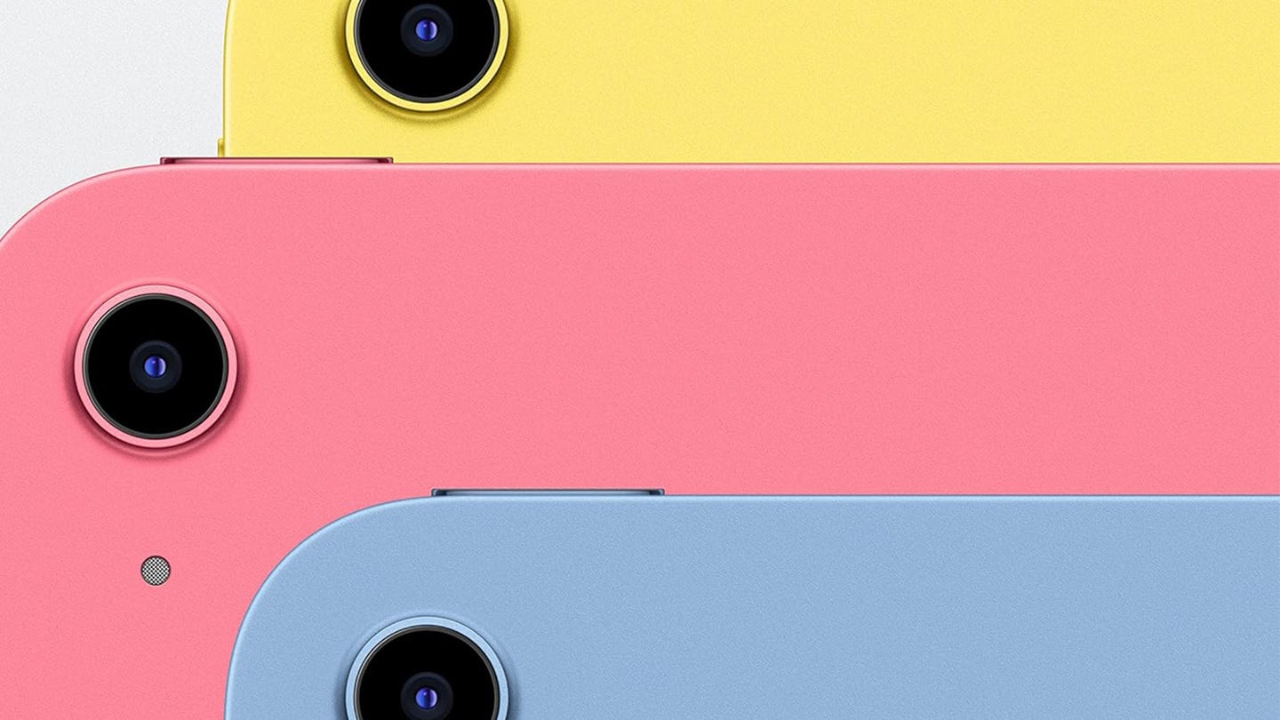 A close-up of three iPad cameras. One is pink, one is yellow, and one is blue.