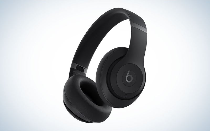 A pair of black Apple Beats Studio Pro headphones on a plain background