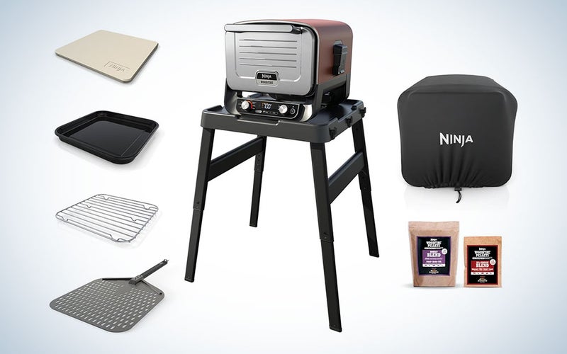 A Ninja outdoor pizza oven kit on a grey and white background