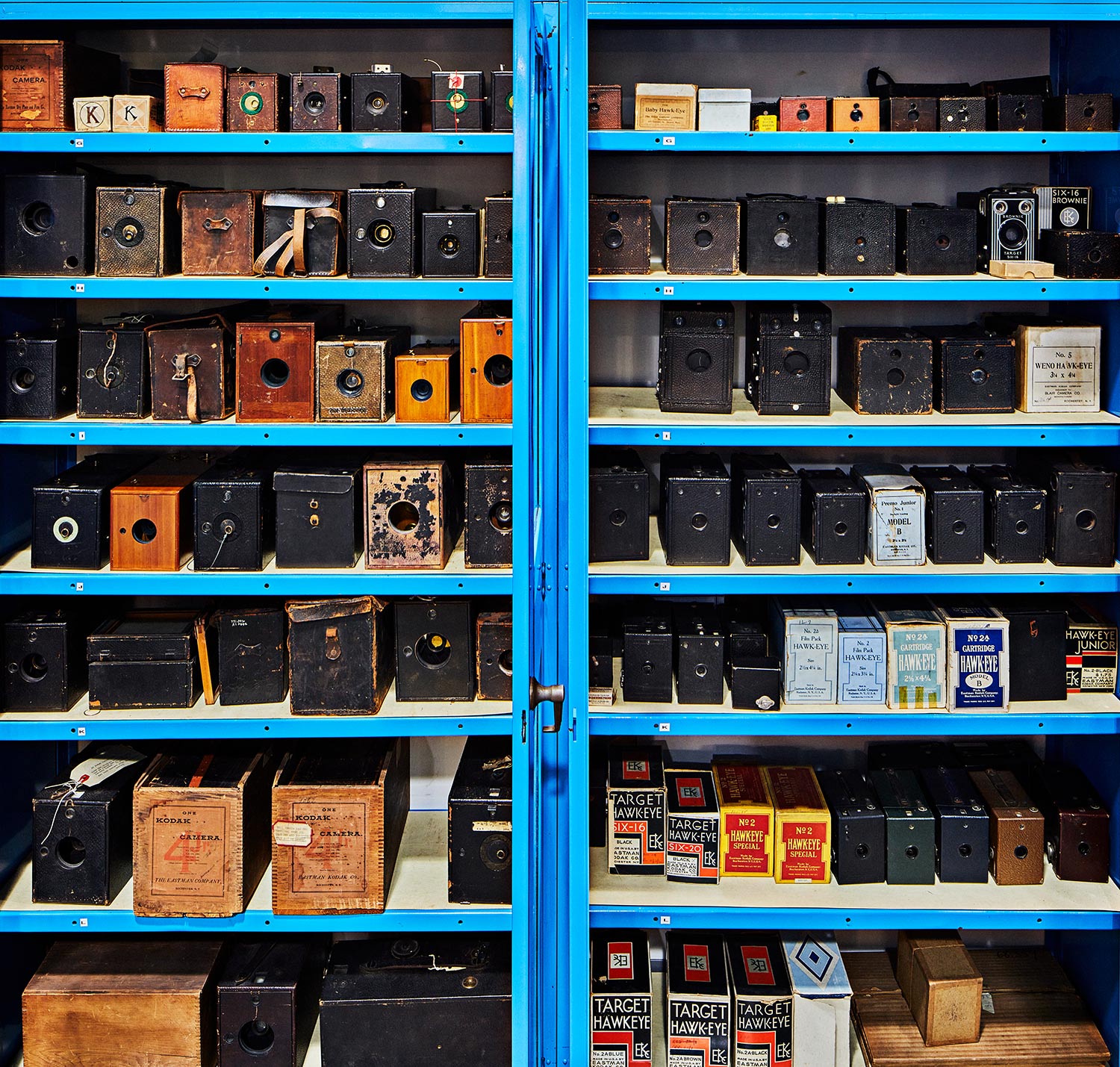 shelves of various cameras in a camera museum